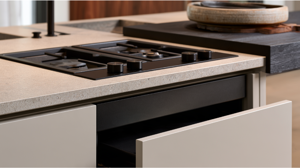 Below the counter cabinets, control knobs, and service access